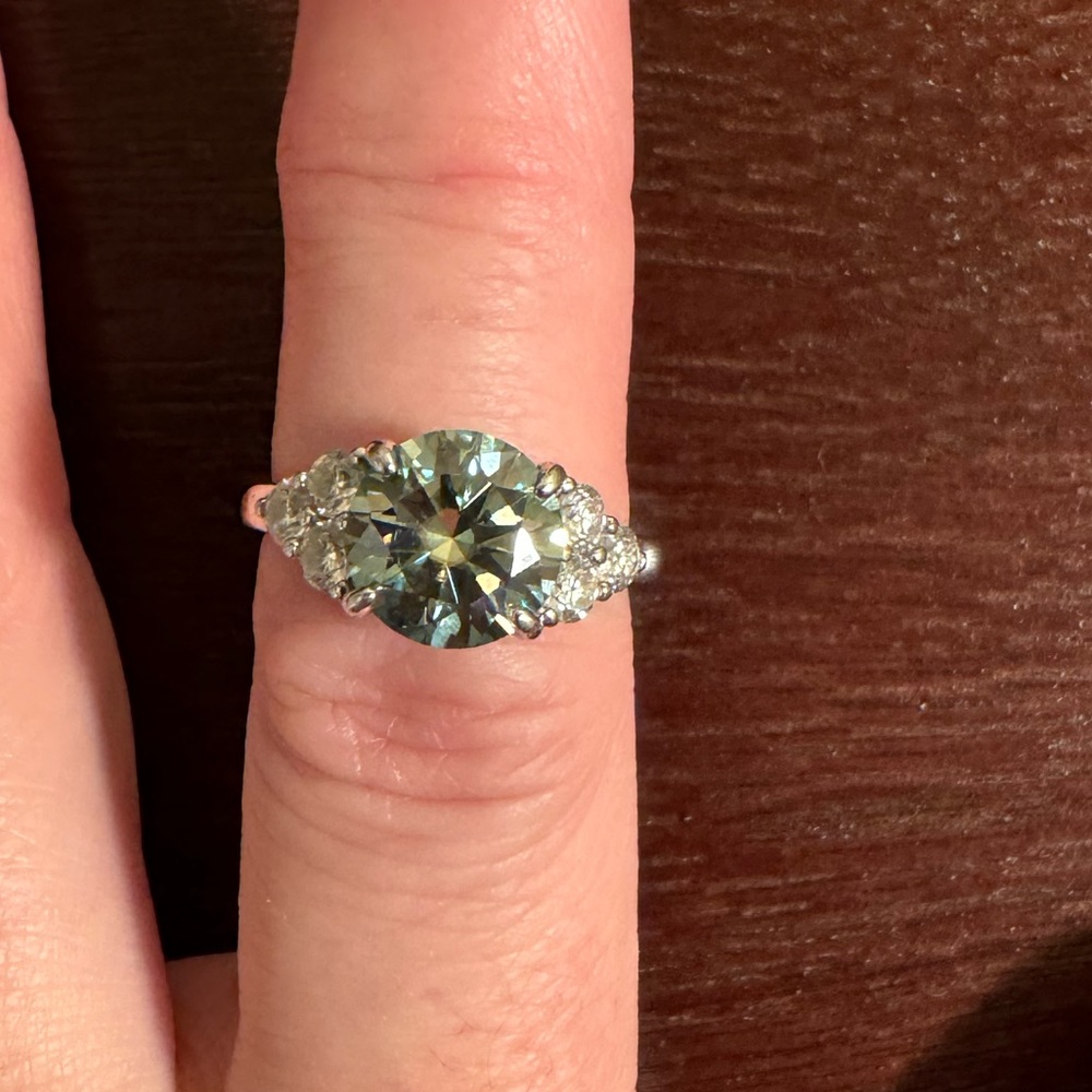 Silver Ring with Green-Blue Moissanite Stone and Side Diamonds